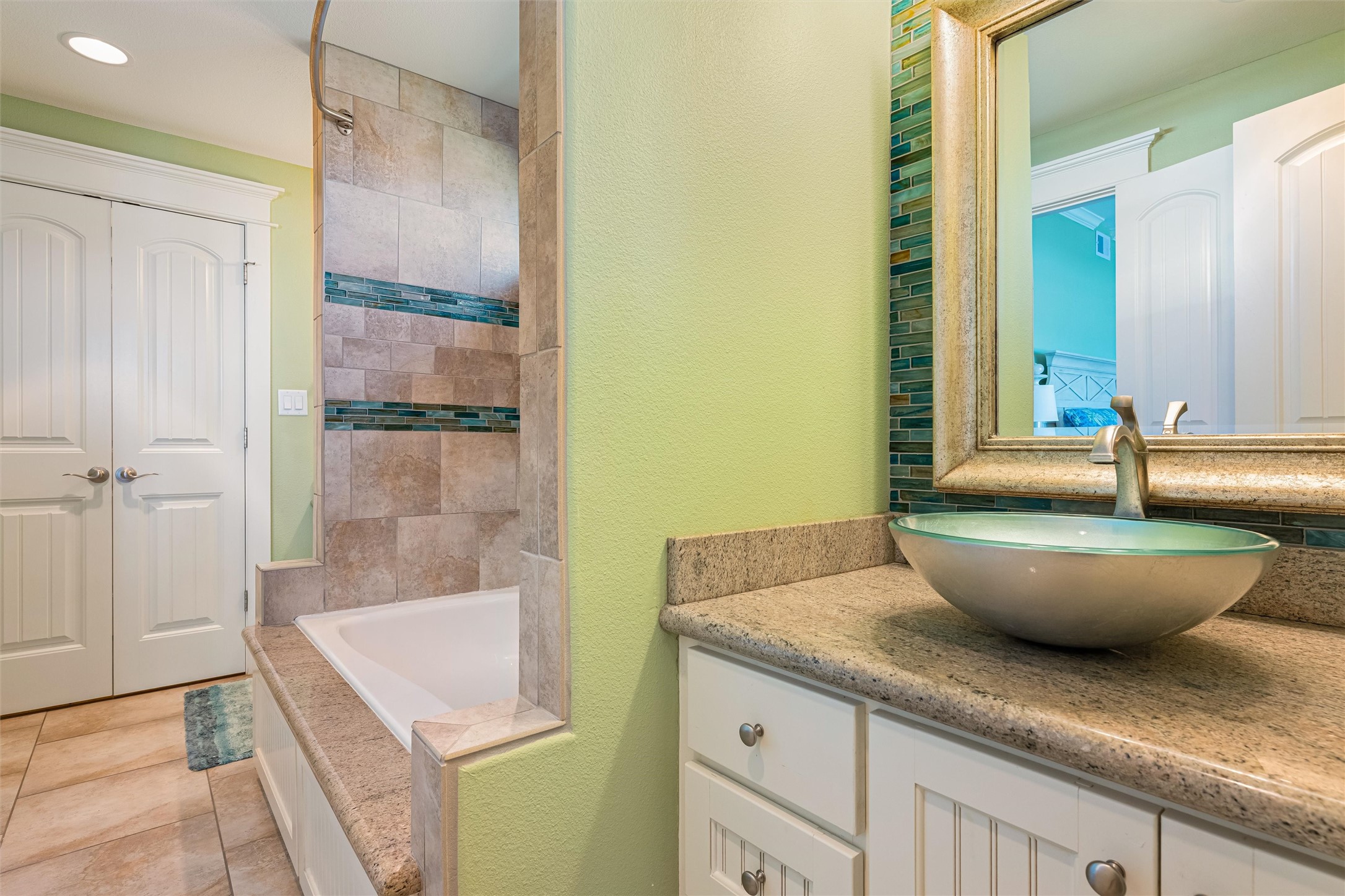 804 Eastview Crystal Beach, TX 77650 - Photo 37 of 50 a large white tub sitting next to a bathroom sink