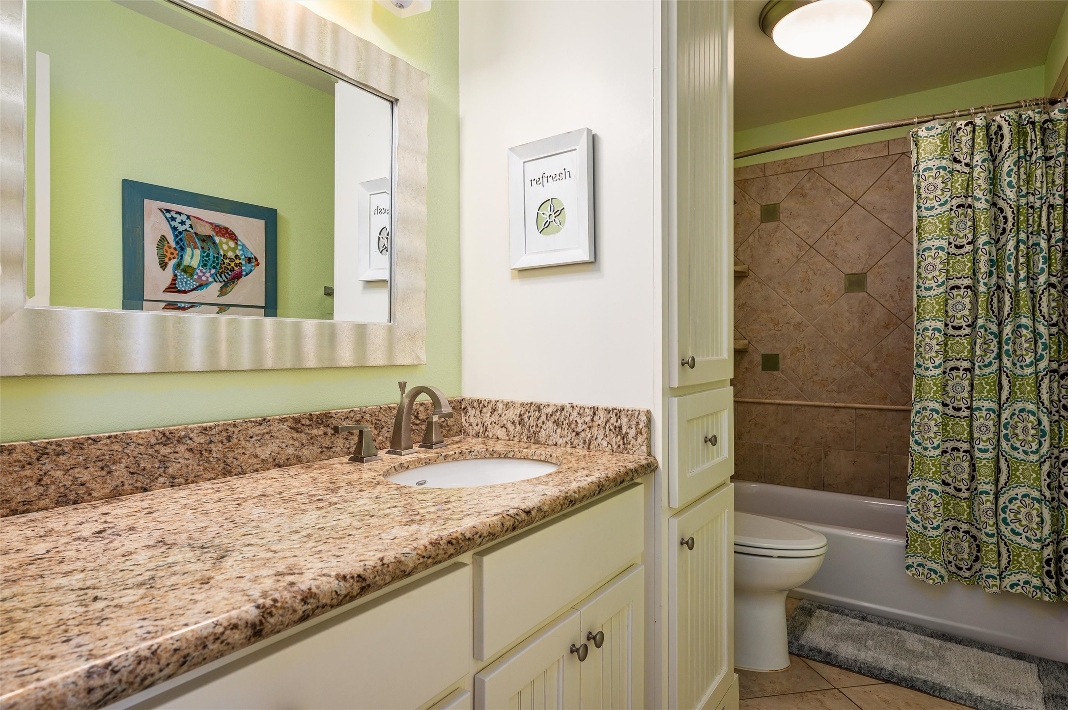 804 Eastview Crystal Beach, TX 77650 - Photo 43 of 50 a bathroom with a granite countertop sink a toilet and shower