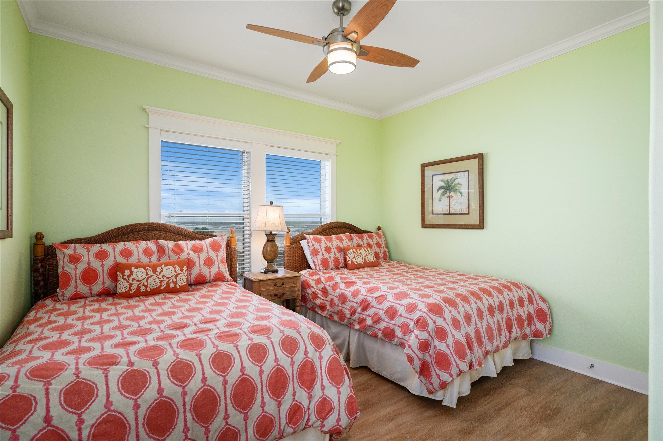 804 Eastview Crystal Beach, TX 77650 - Photo 44 of 50 a bedroom with two beds and lamps