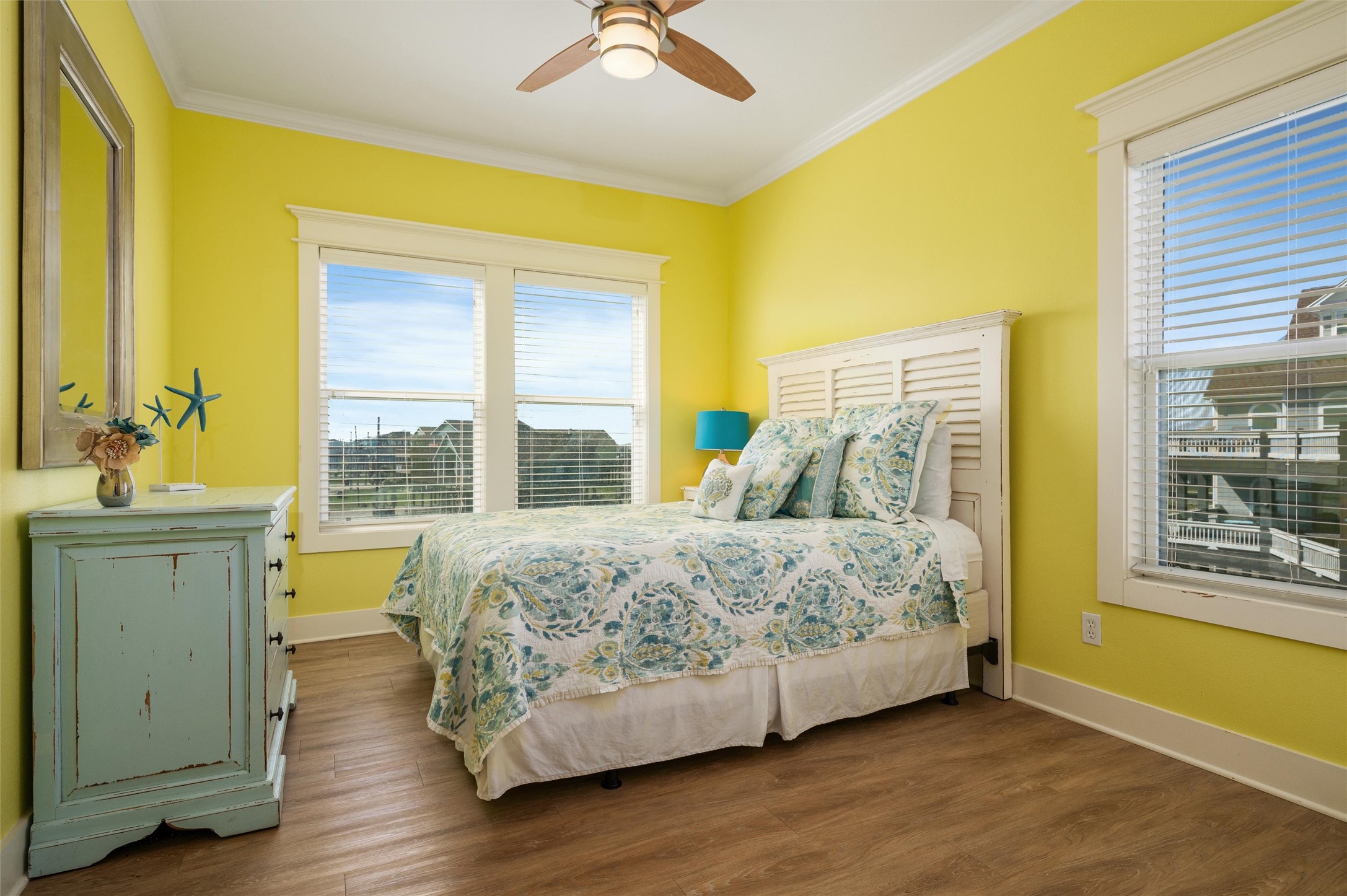 804 Eastview Crystal Beach, TX 77650 - Photo 46 of 50 a bedroom with a bed and wooden floor