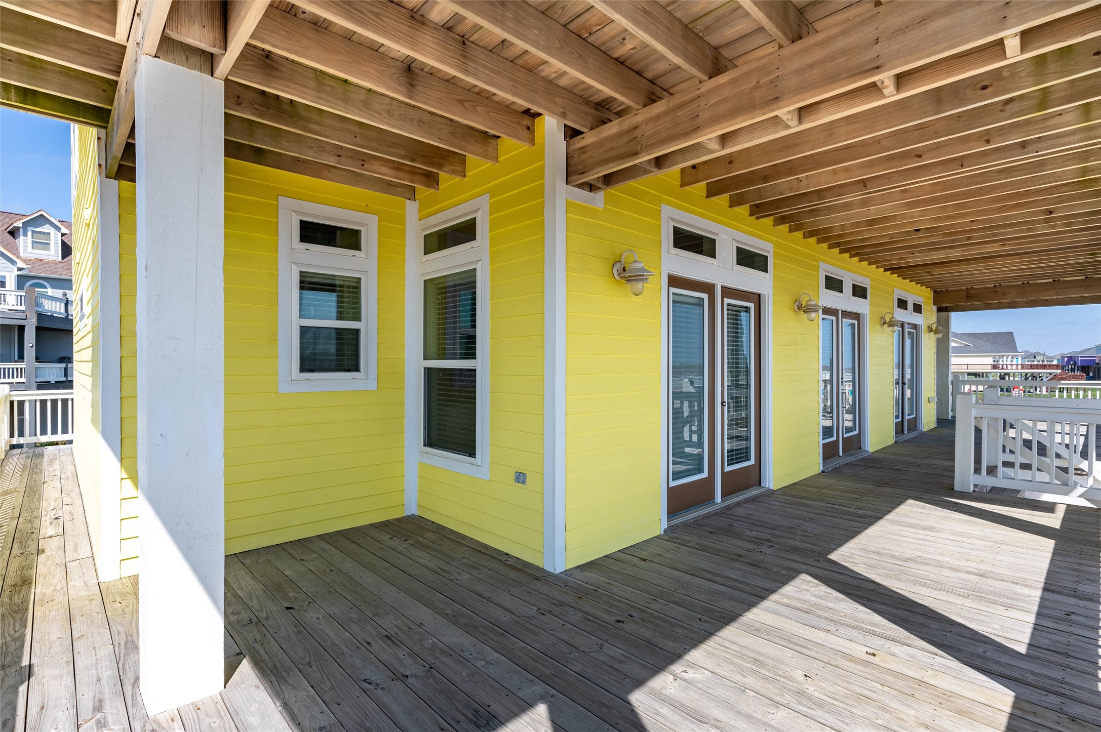 804 Eastview Crystal Beach, TX 77650 - Photo 49 of 50 a view of a porch with wooden floor