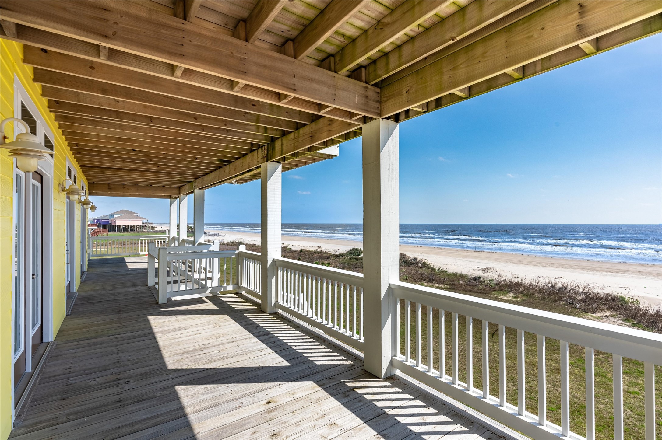 804 Eastview Crystal Beach, TX 77650 - Photo 7 of 50 a view of a balcony with wooden floor