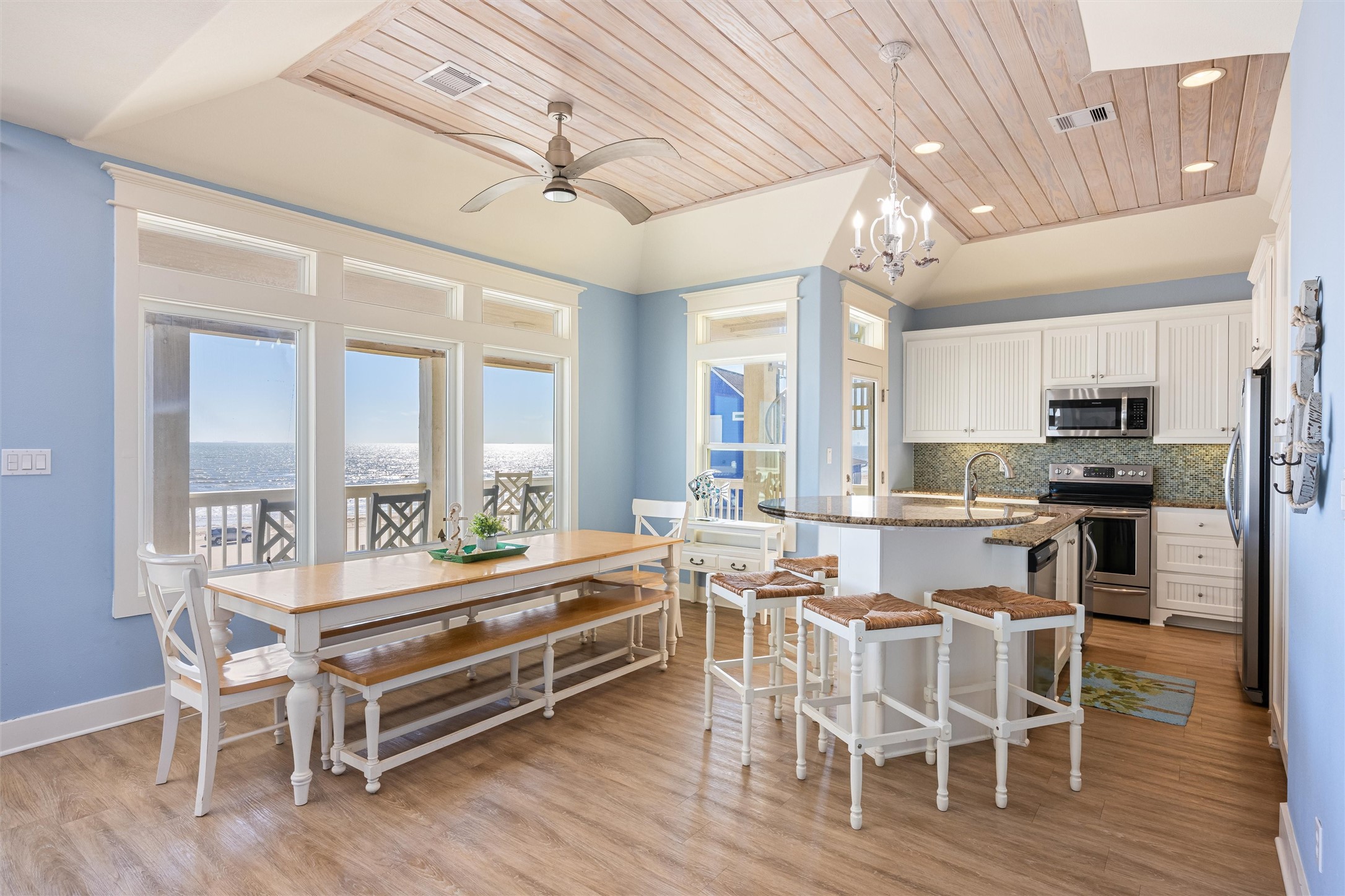 804 Eastview Crystal Beach, TX 77650 - Photo 9 of 50 a view of a dining room with furniture window and wooden floor
