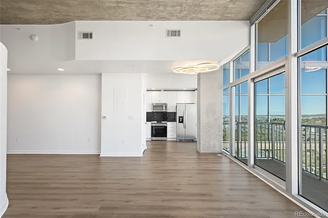 a view of a living room with hardwood floor