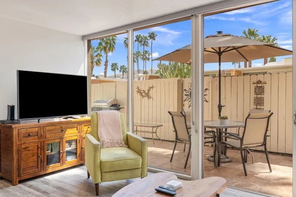 a living room with furniture and a flat screen tv