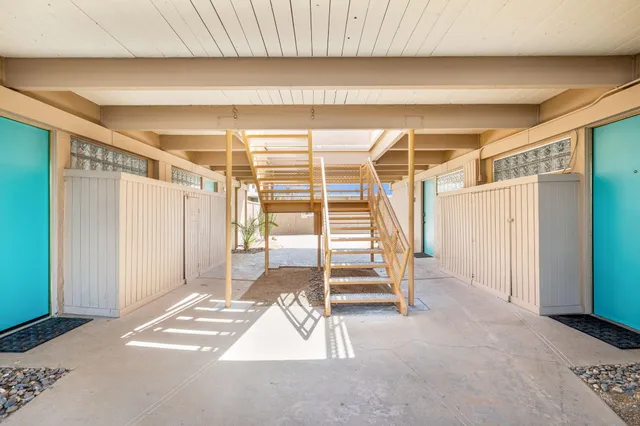 a view of an empty room with stairs