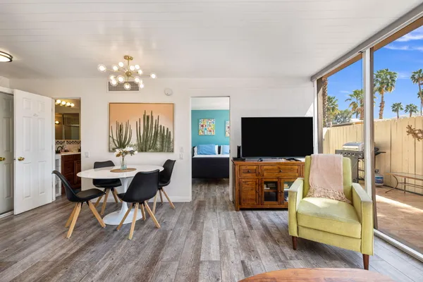 a living room with fireplace furniture and a flat screen tv