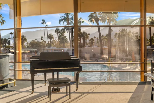 a view of a swimming pool with a patio