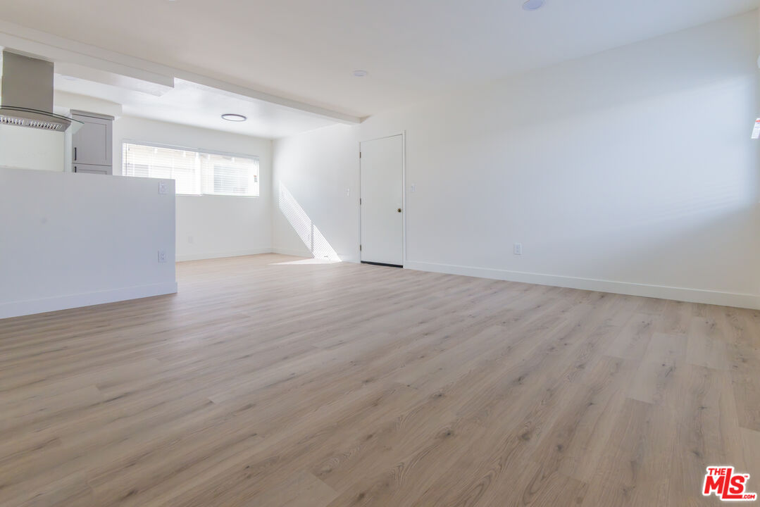 1303 Beryl Street, Unit B Redondo Beach, CA 90277 - Photo 5 of 22 a view of empty room with wooden floor