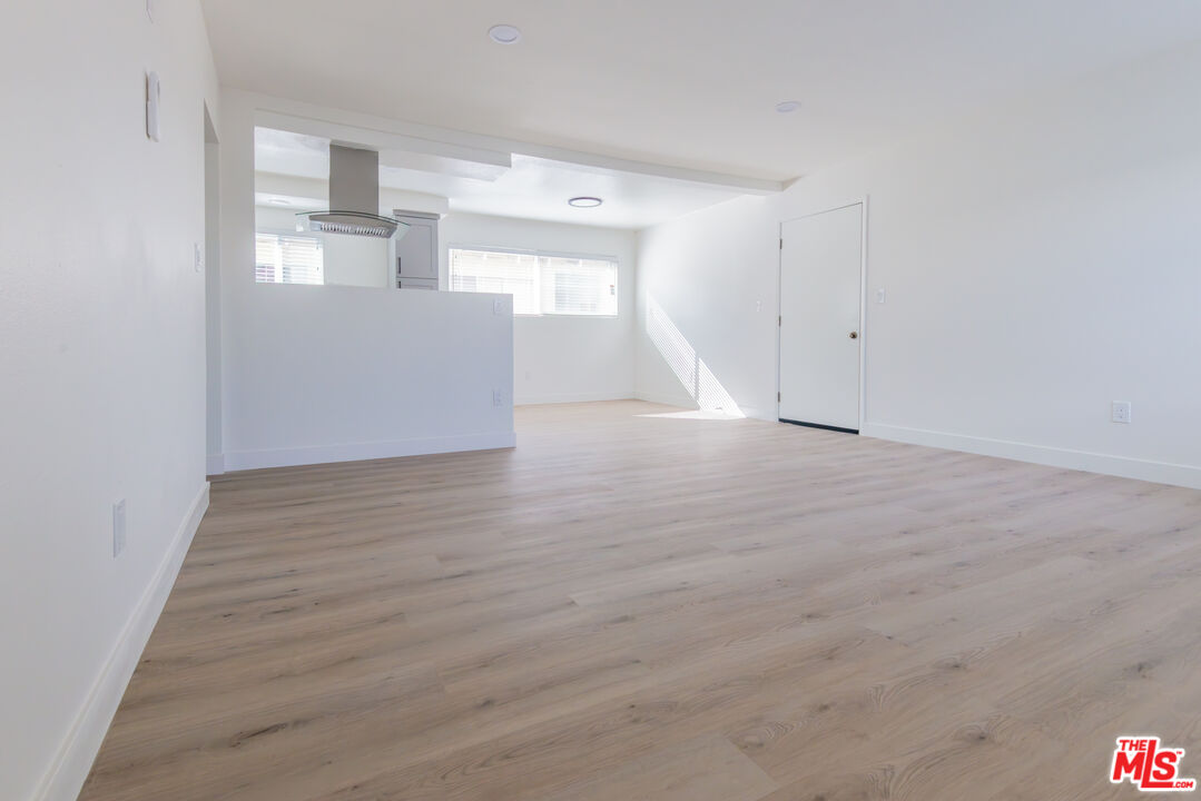 1303 Beryl Street, Unit B Redondo Beach, CA 90277 - Photo 6 of 22 a view of empty room with wooden floor