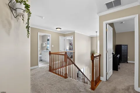 a view of a hallway view with three rooms