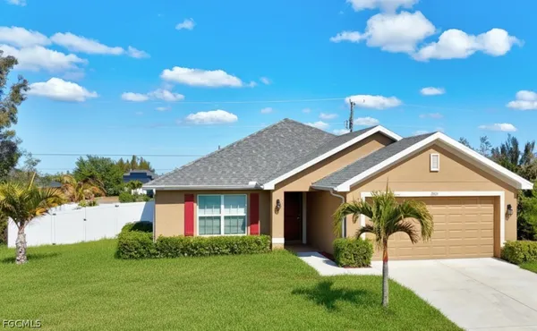 a front view of a house with a yard