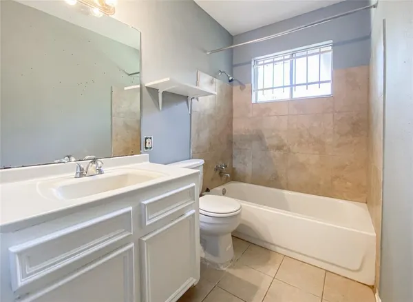 a bathroom with a sink a toilet and a bathtub