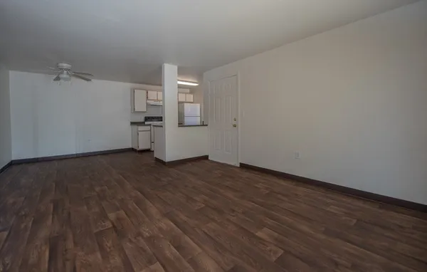 a view of a room with wooden floor