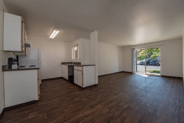 a view of kitchen with furniture and wooden floor