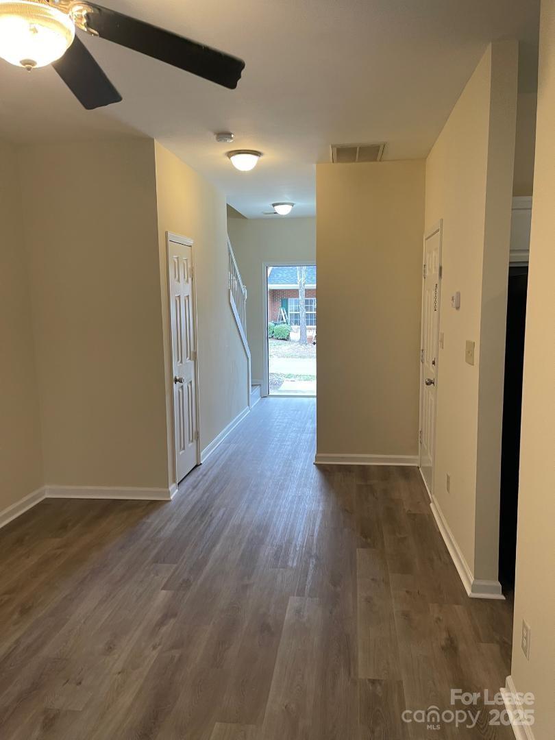 2121 Lennox Square Road Charlotte, NC 28210 - Photo 2 of 17 a view of a hallway with wooden floor