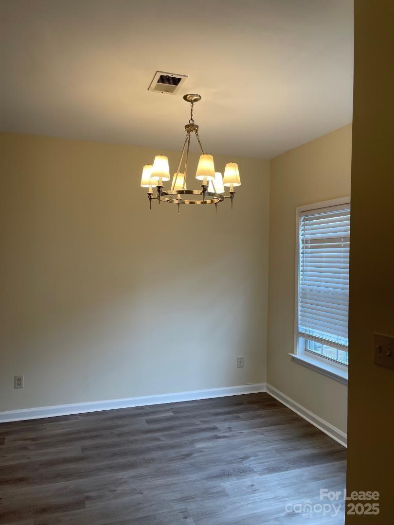 2121 Lennox Square Road Charlotte, NC 28210 - Photo 8 of 17 a view of a chandelier in a room