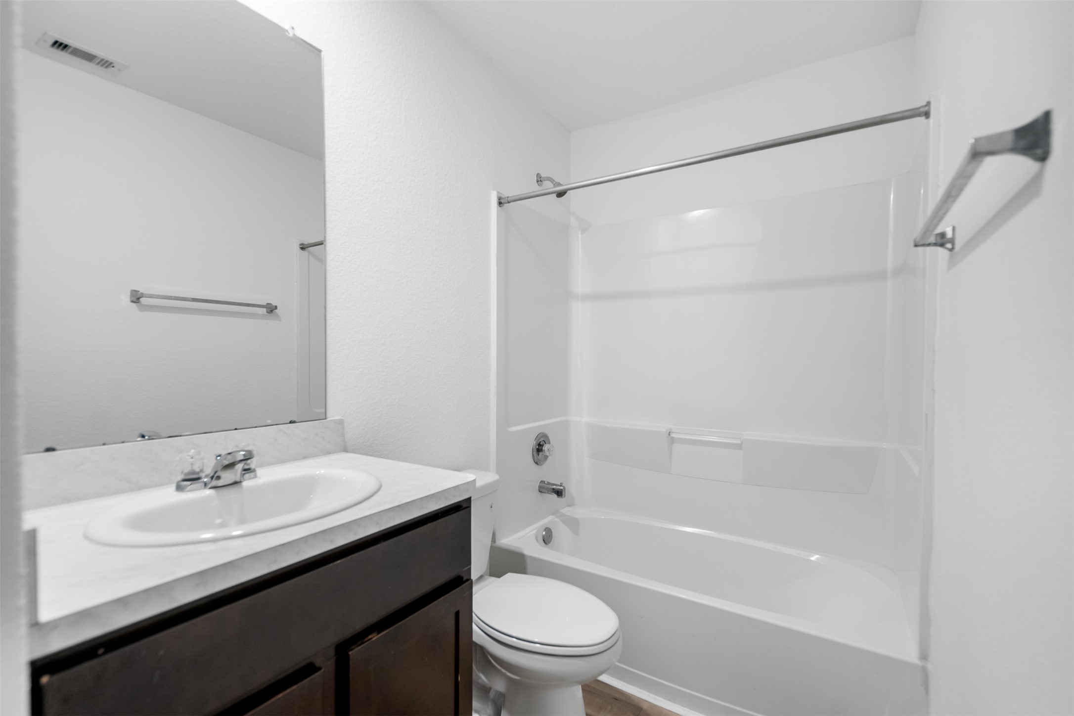 14519 Broadbury Pond Road Rosharon, TX 77583 - Photo 12 of 22 a bathroom with a sink a toilet and a bathtub