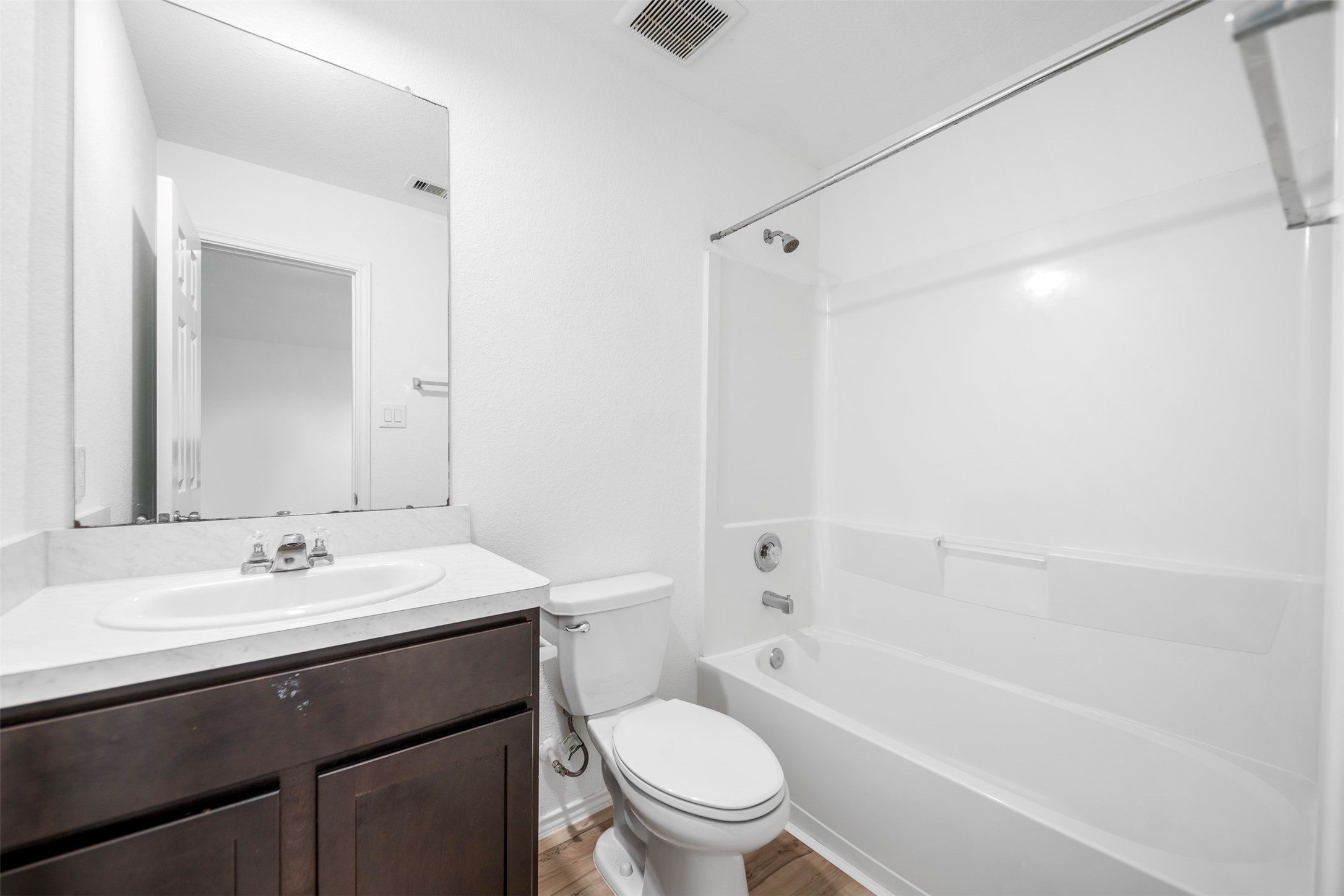 14519 Broadbury Pond Road Rosharon, TX 77583 - Photo 16 of 22 a bathroom with a sink a toilet and shower