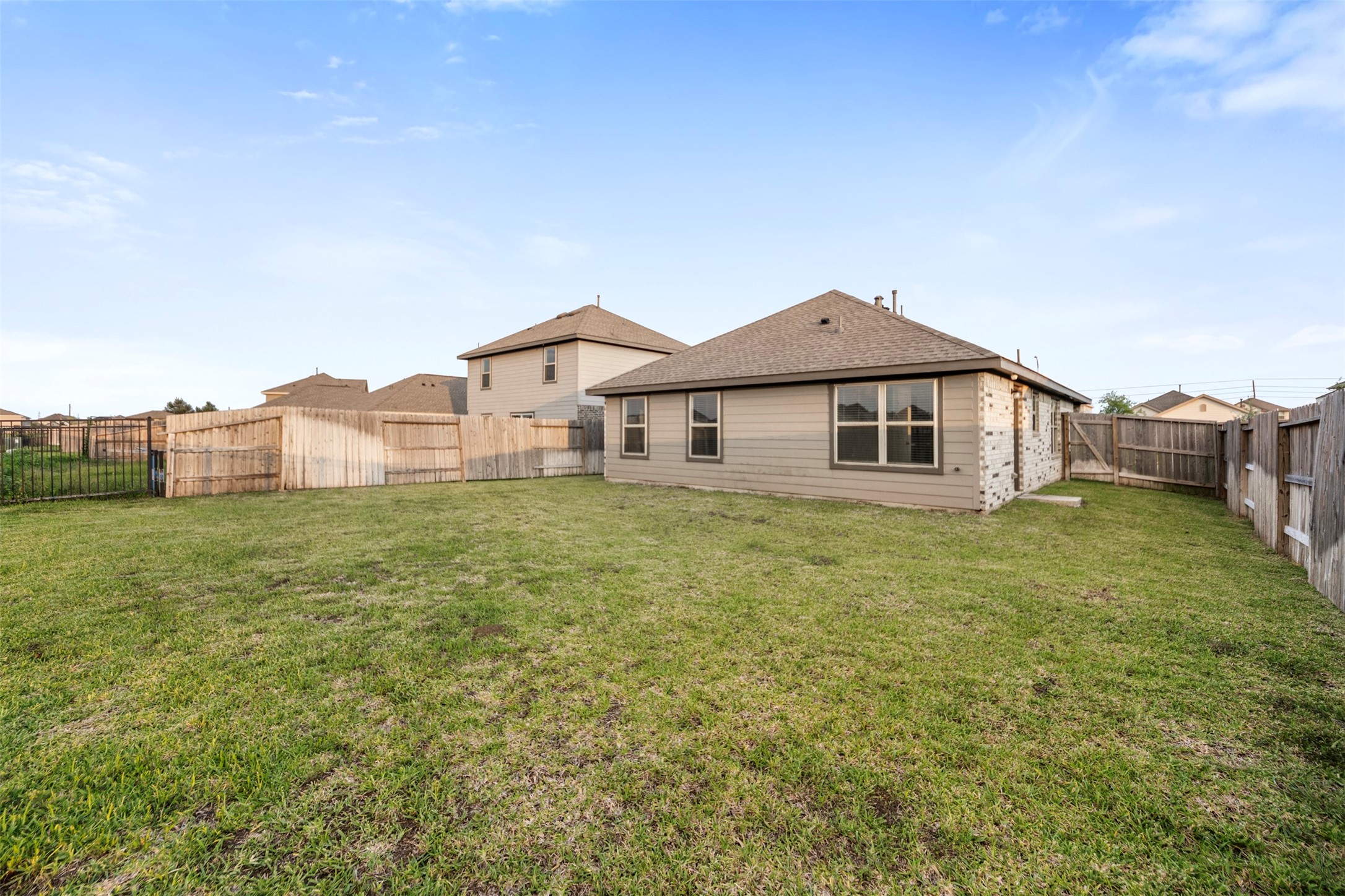 14519 Broadbury Pond Road Rosharon, TX 77583 - Photo 21 of 22 a front view of a house with a garden and porch