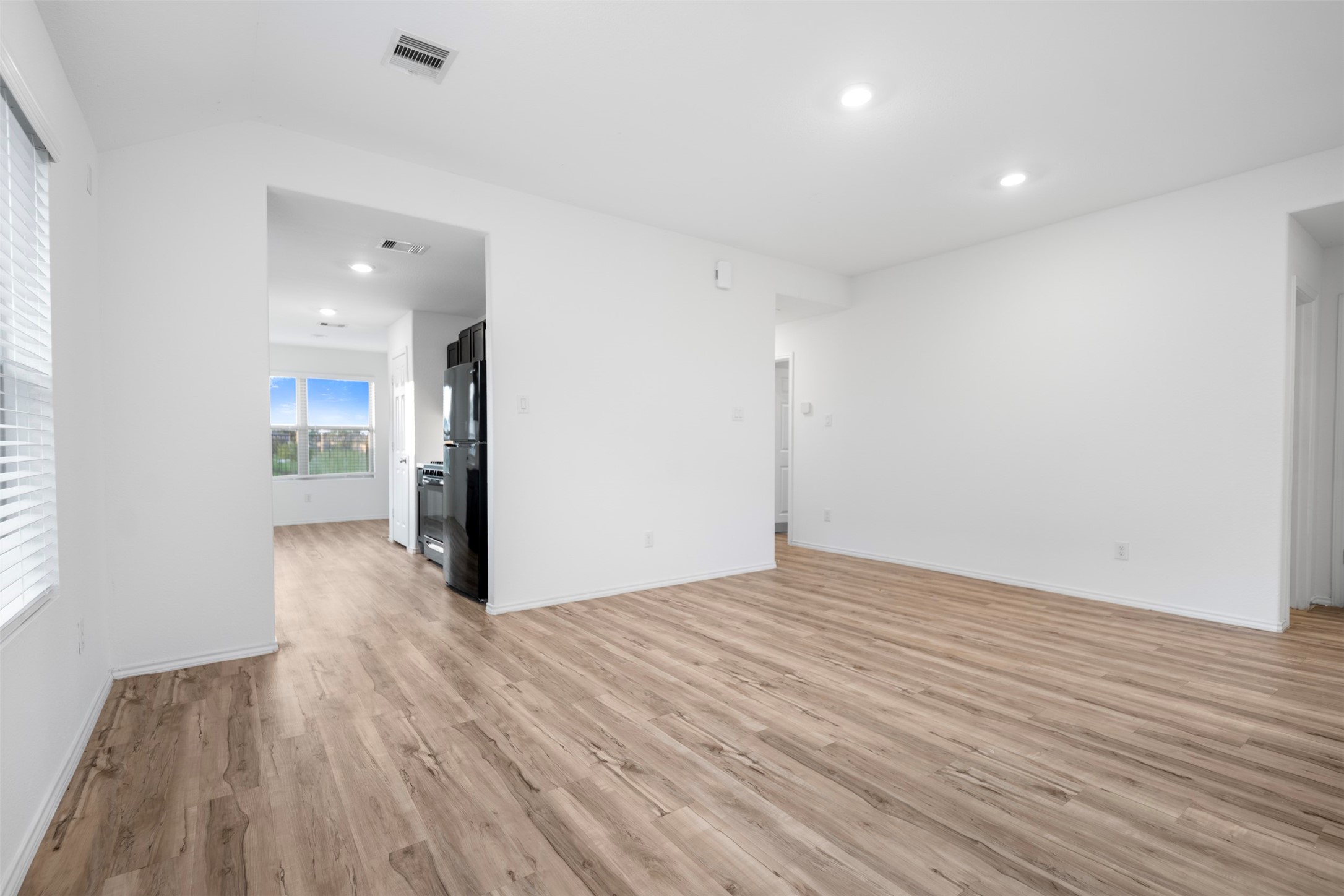 14519 Broadbury Pond Road Rosharon, TX 77583 - Photo 4 of 22 a view of empty room with wooden floor