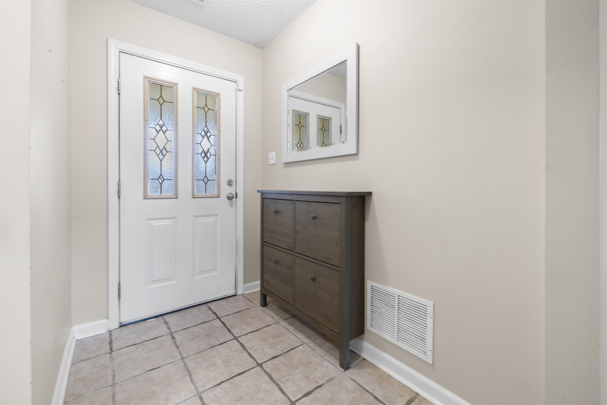 220 Terry Road Somerville, TN 38068 - Photo 6 of 29 an empty room with mirror and window