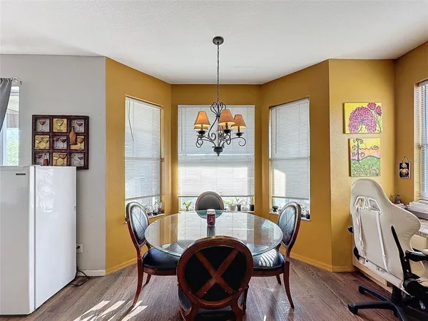 a spacious bedroom with a bed and ceiling fan