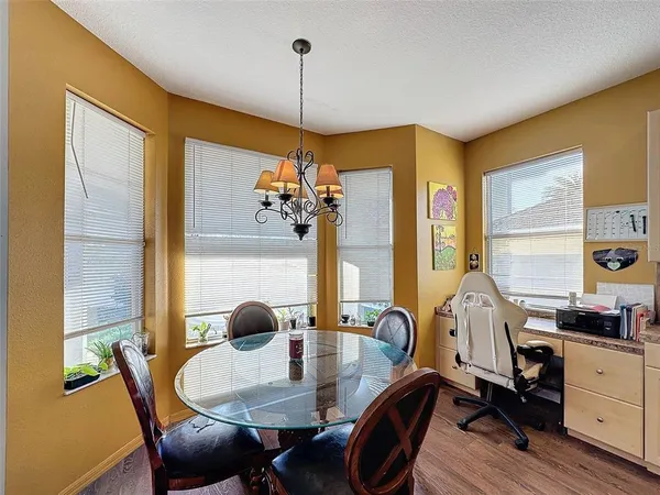 a bathroom with a double vanity sink a mirror a bathtub and shower