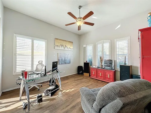 a view of a hallway with wooden floor and stairs