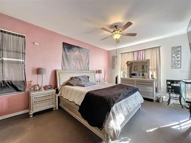 a bed room with a bed and a mirror