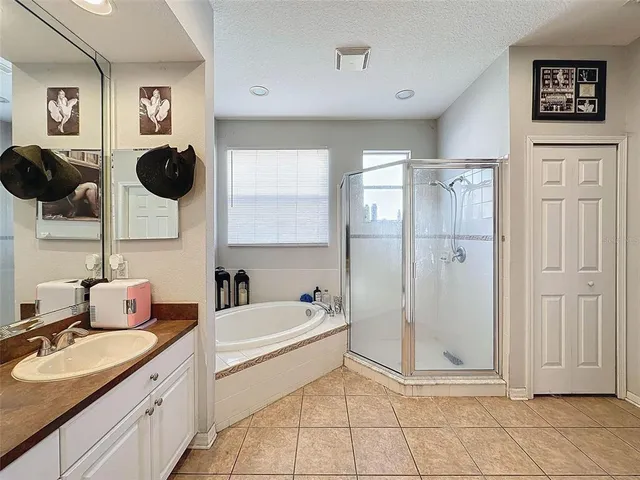 a bathroom with a toilet a sink and a large mirror