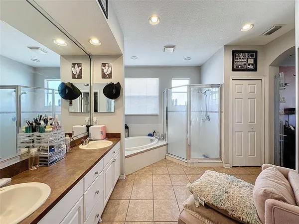 a bedroom with a bed and a mirror