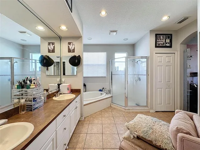 a bedroom with a bed and a mirror