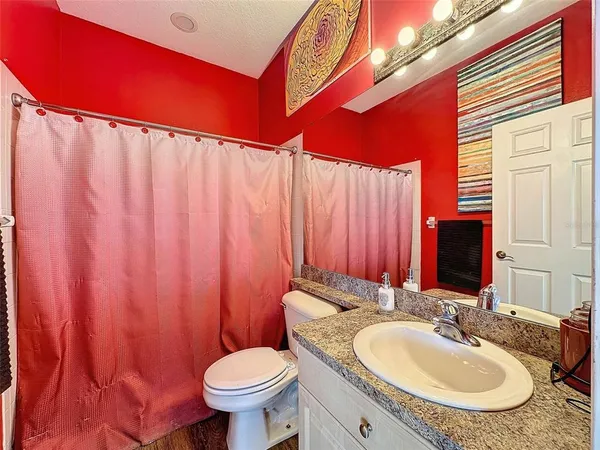 a bedroom with a bed and a chair