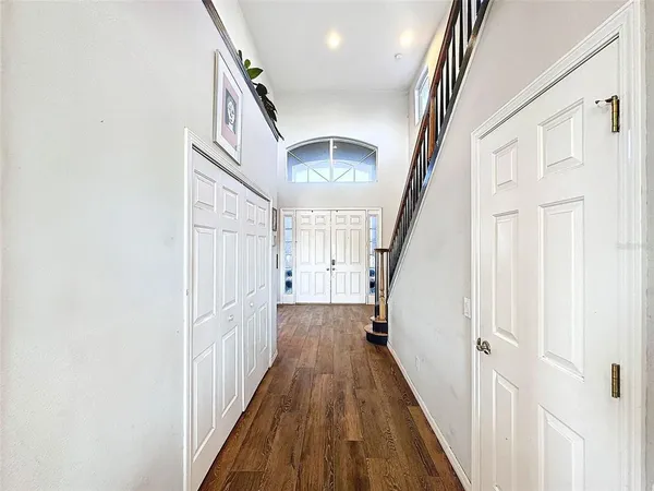 a view of entryway with livingroom and wooden floor