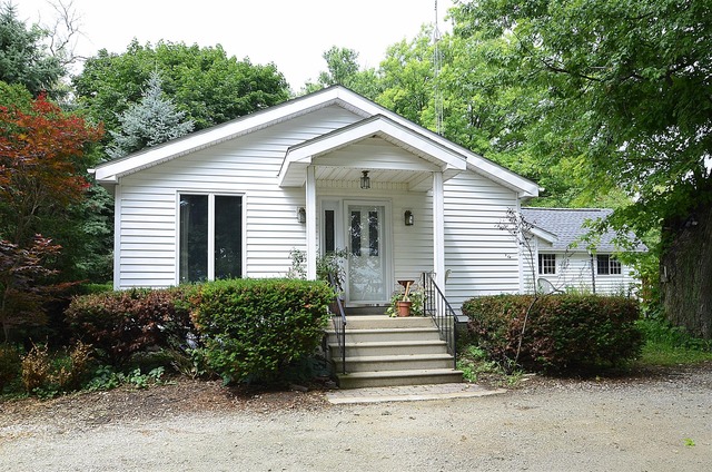 50W338 Ramm Road Maple Park, IL 60151 - Photo 1 of 25 a view of a house with backyard and plants