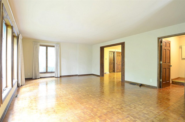 50W338 Ramm Road Maple Park, IL 60151 - Photo 2 of 25 a view of an empty room with window and wooden floor