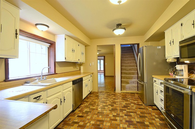 50W338 Ramm Road Maple Park, IL 60151 - Photo 10 of 25 a kitchen with stainless steel appliances granite countertop a sink stove and refrigerator