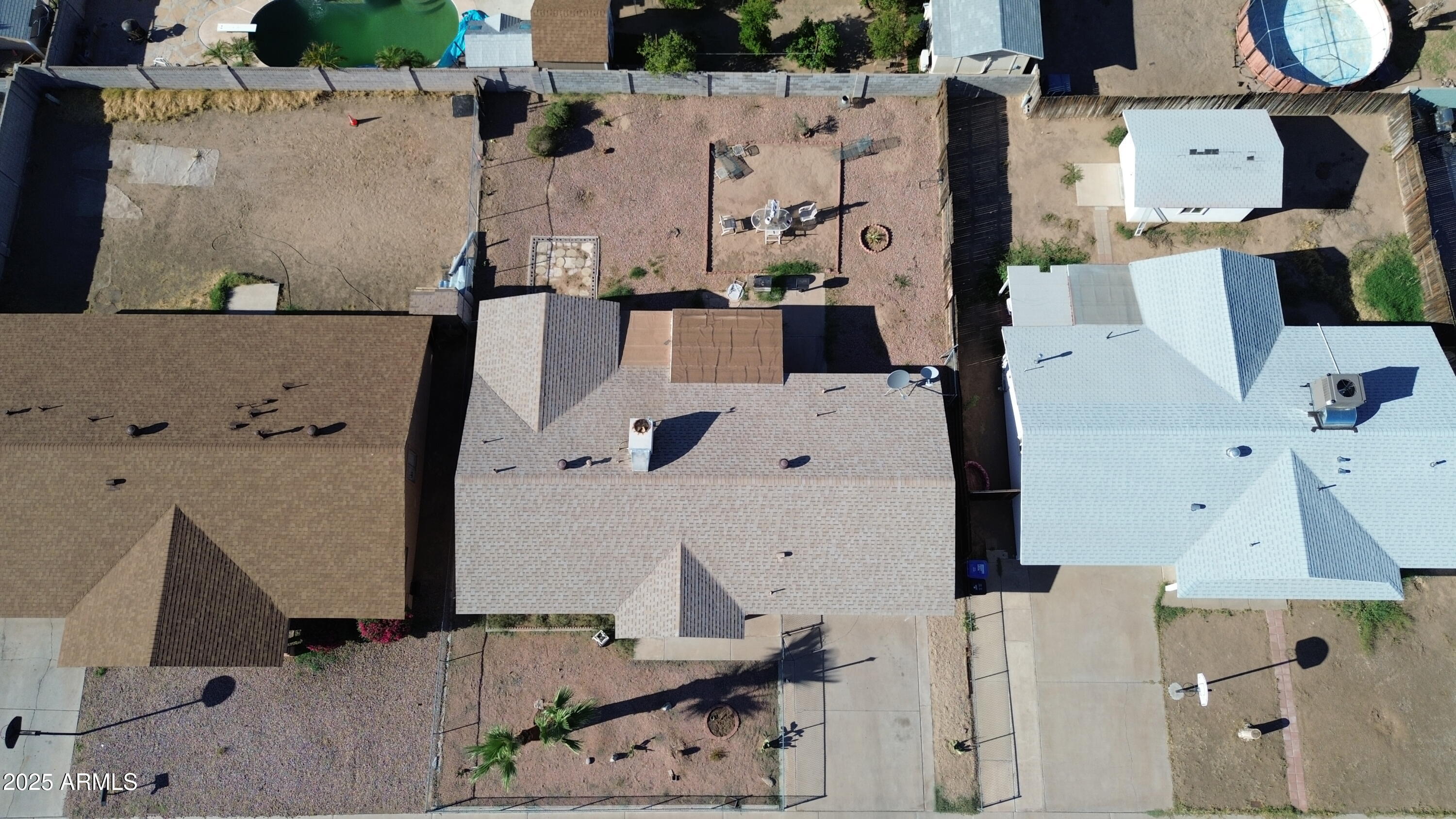 8524 West Weldon Avenue Phoenix, AZ 85037 - Photo 14 of 17 an aerial view of residential houses with outdoor space