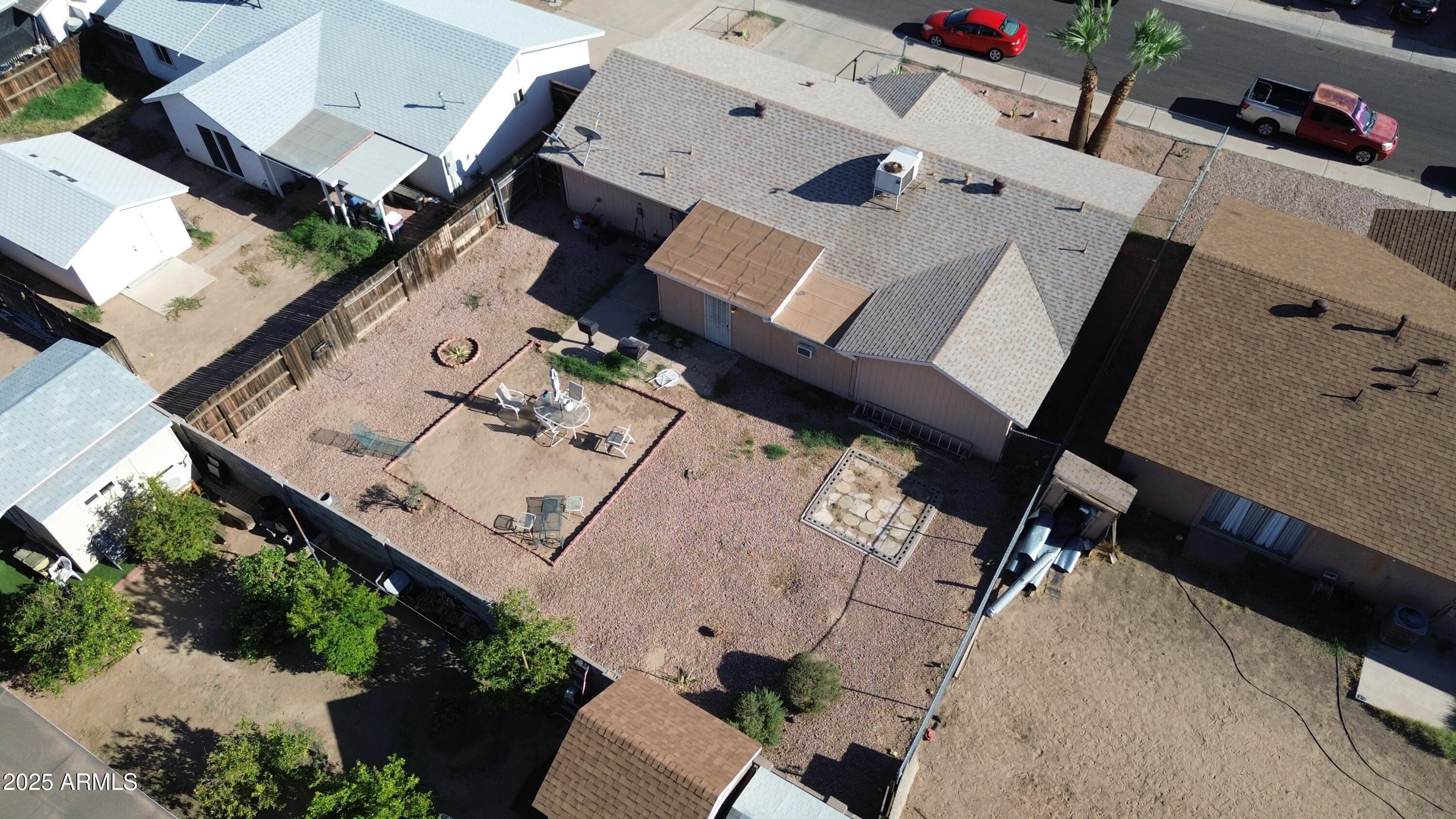 8524 West Weldon Avenue Phoenix, AZ 85037 - Photo 16 of 17 an aerial view of a house with a big yard and large trees