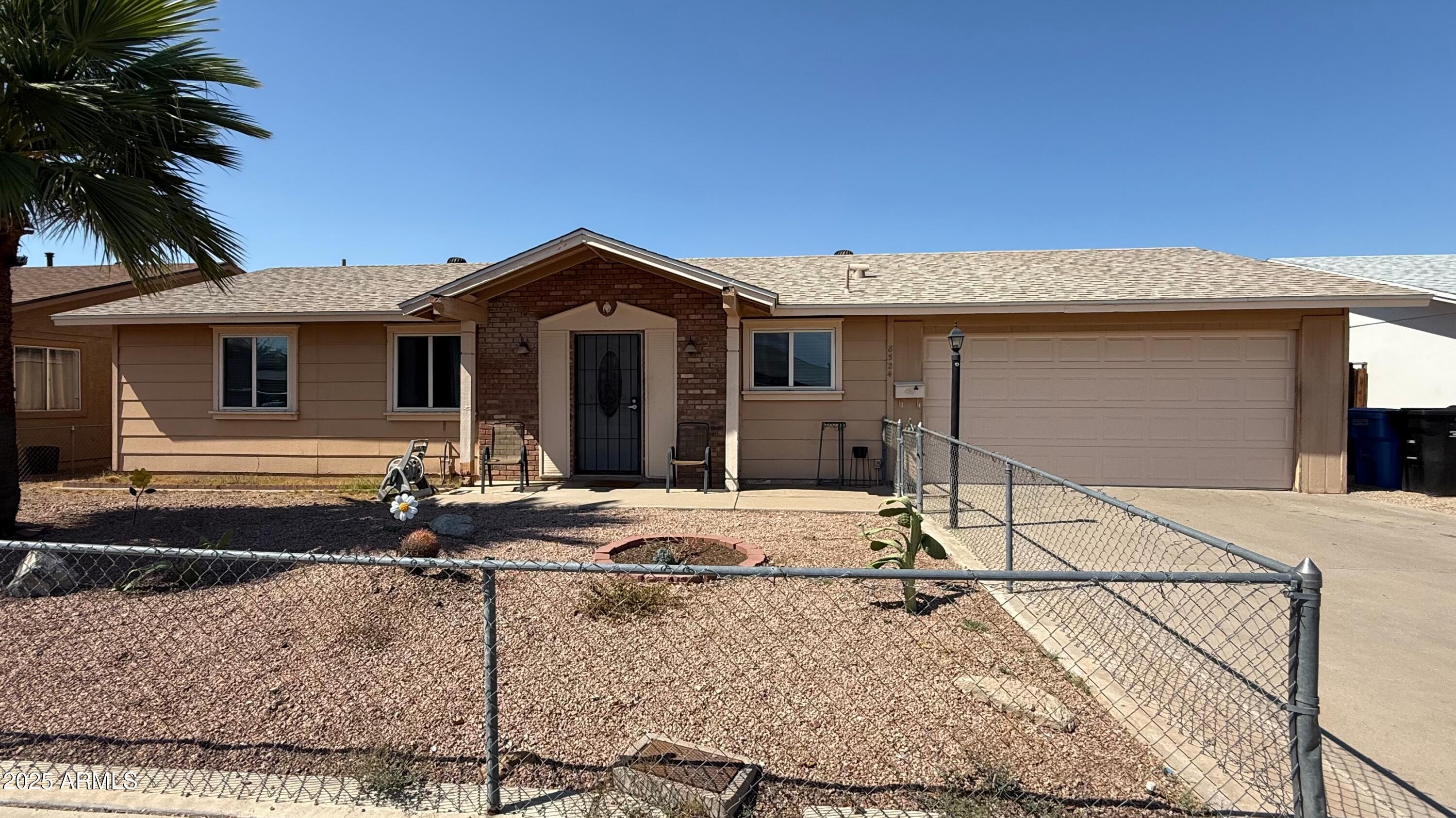 8524 West Weldon Avenue Phoenix, AZ 85037 - Photo 17 of 17 a front view of a house with porch