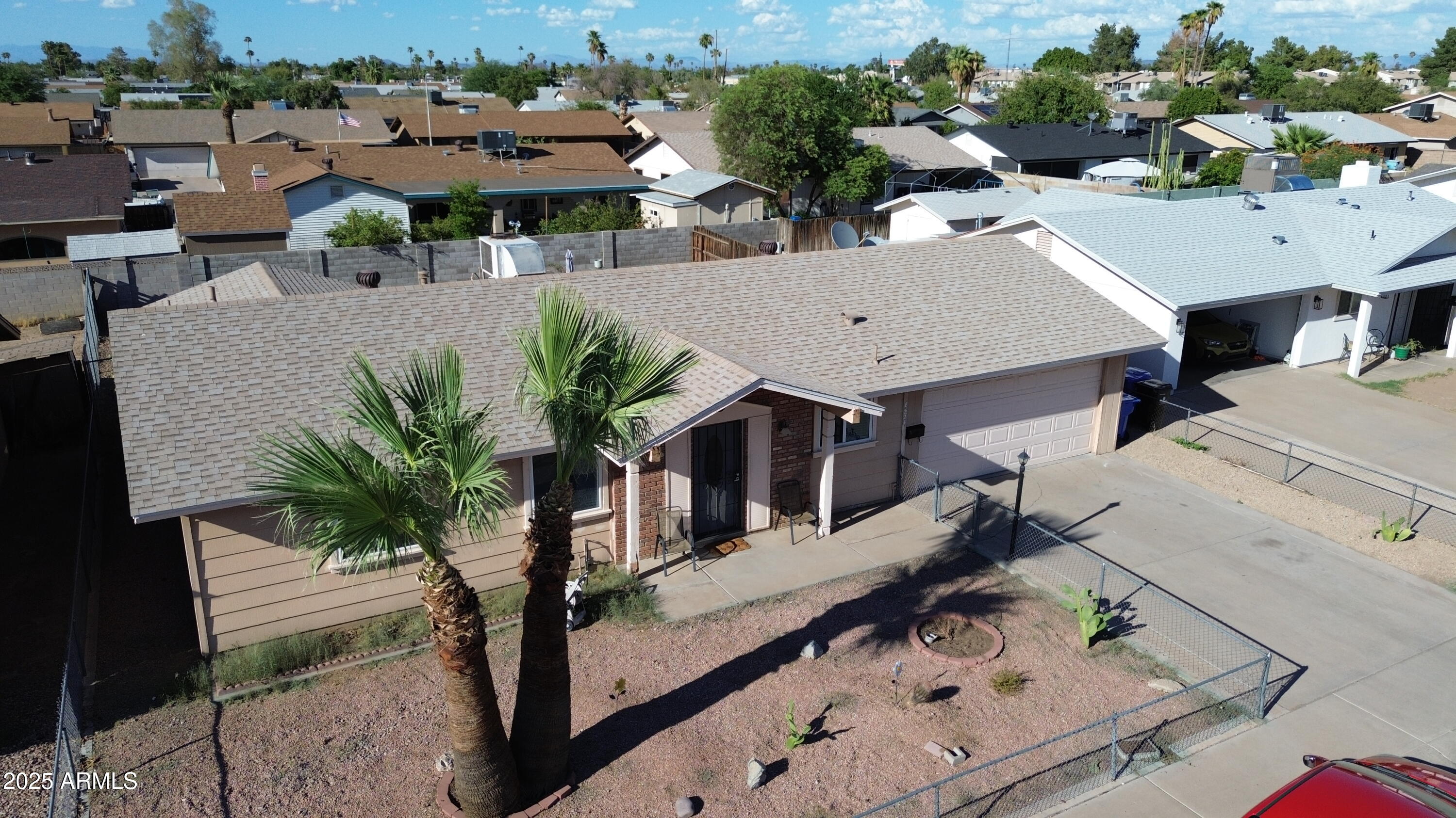 8524 West Weldon Avenue Phoenix, AZ 85037 - Photo 3 of 17 a view of a house with backyard and sitting area