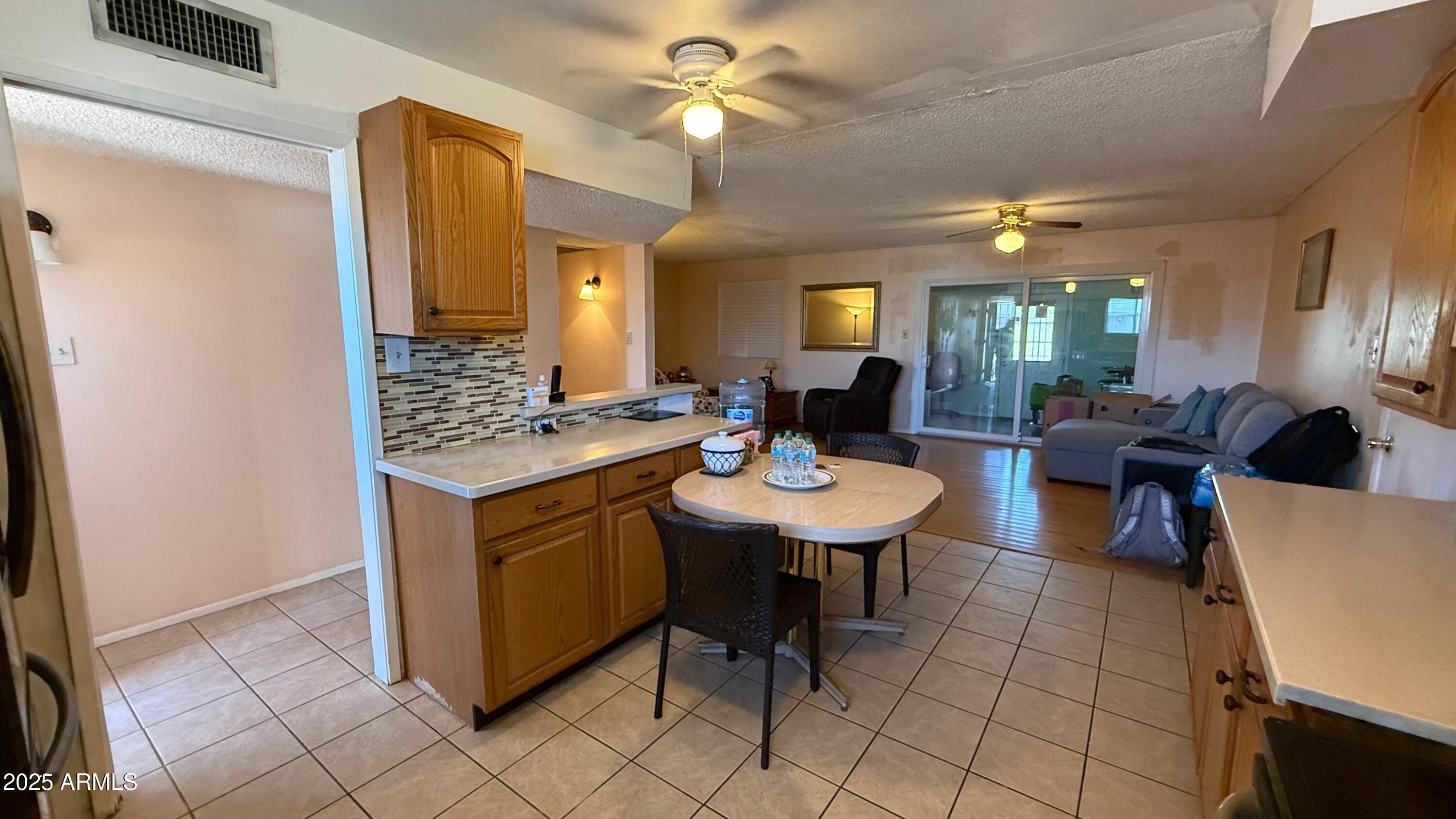 8524 West Weldon Avenue Phoenix, AZ 85037 - Photo 5 of 17 a view of a dining room with furniture