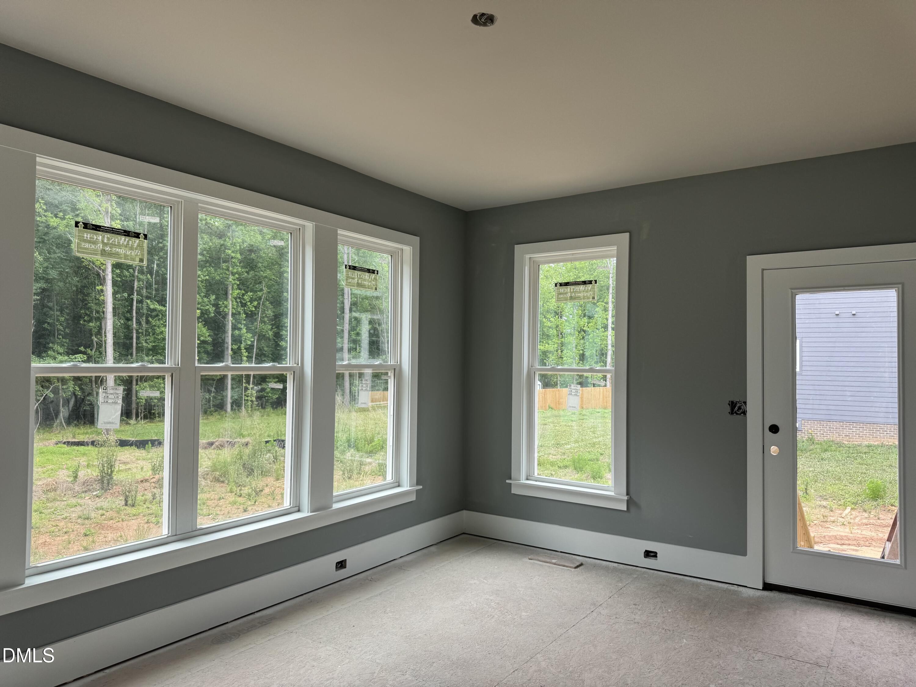 935 Lynch Road Selma, NC 27576 - Photo 8 of 21 a view of an empty room with a window