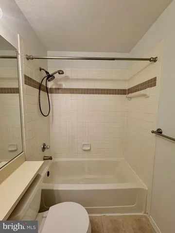 a bathroom with a shower and a toilet