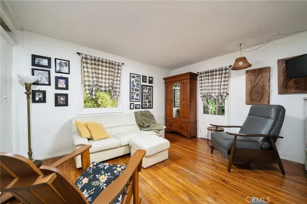 a kitchen with white cabinets and appliances