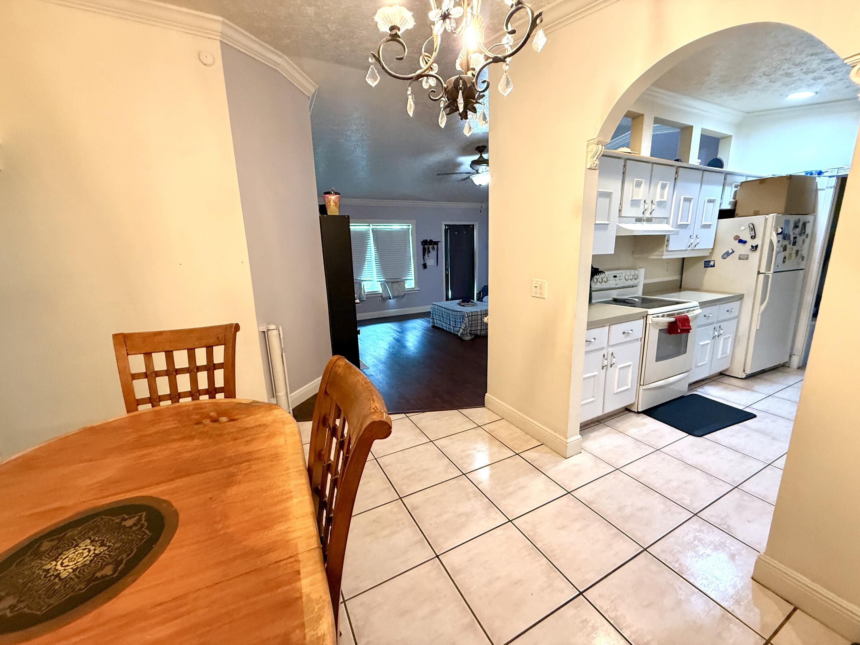 1114 Southwest Del Rio Boulevard Port St. Lucie, FL 34953 - Photo 15 of 31 Dining to kitchen and living room
