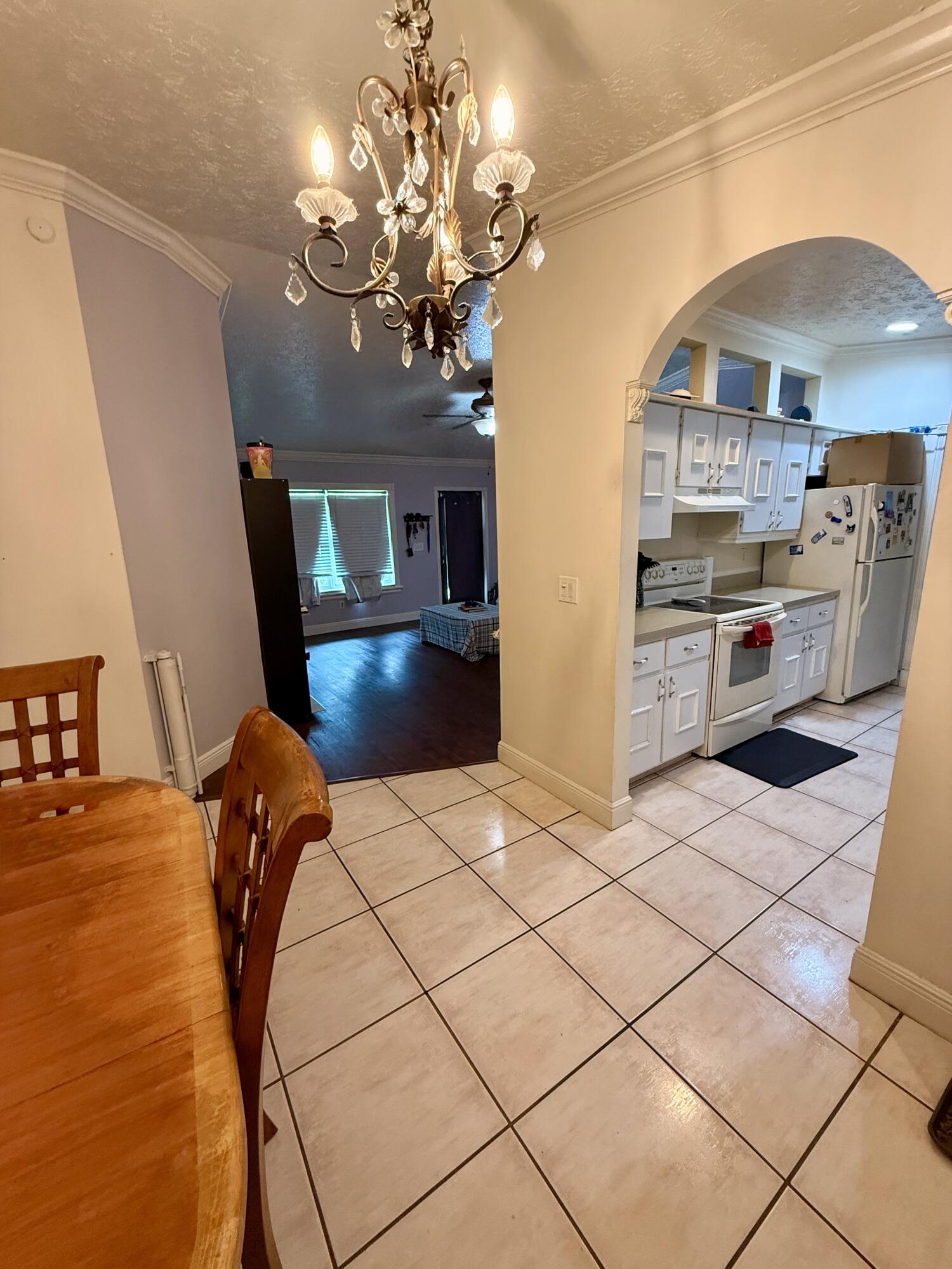 1114 Southwest Del Rio Boulevard Port St. Lucie, FL 34953 - Photo 16 of 31 Dining to Kitchen:Living