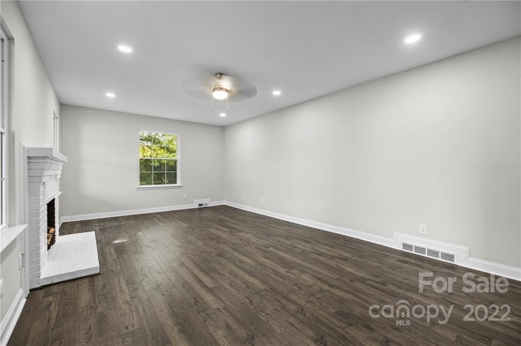 6000 Hickory Grove Road Charlotte, NC 28215 - Photo 23 of 40 an empty room with wooden floor and a window