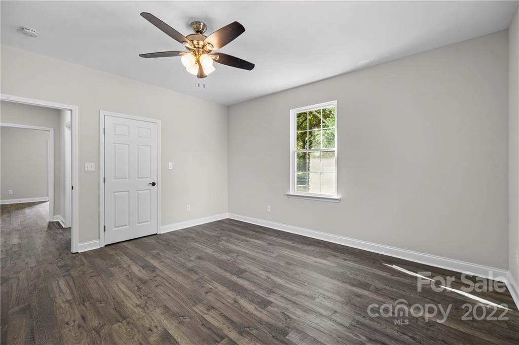 6000 Hickory Grove Road Charlotte, NC 28215 - Photo 32 of 40 an empty room with wooden floor and windows